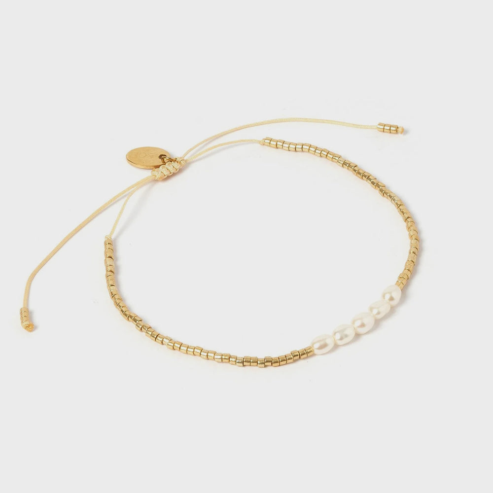 
                  
                    Seline Gold & Pearl Bracelet
                  
                